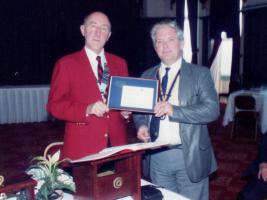 President Alan Kenyon receives the SAA 